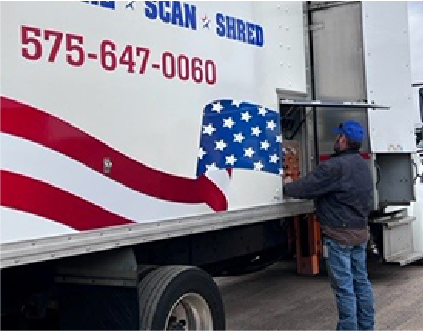Employee using mobile document shredding truck