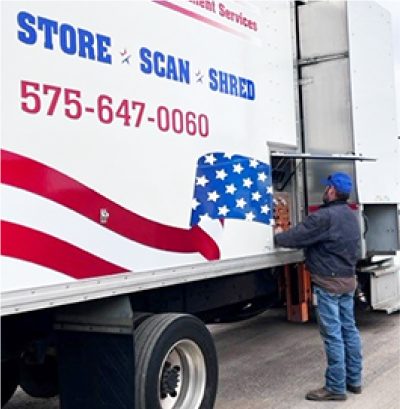 Employee using mobile document shredding truck