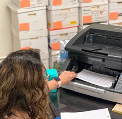 Employee scanning documents