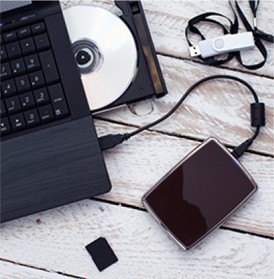 An external hard drive plugged into a laptop